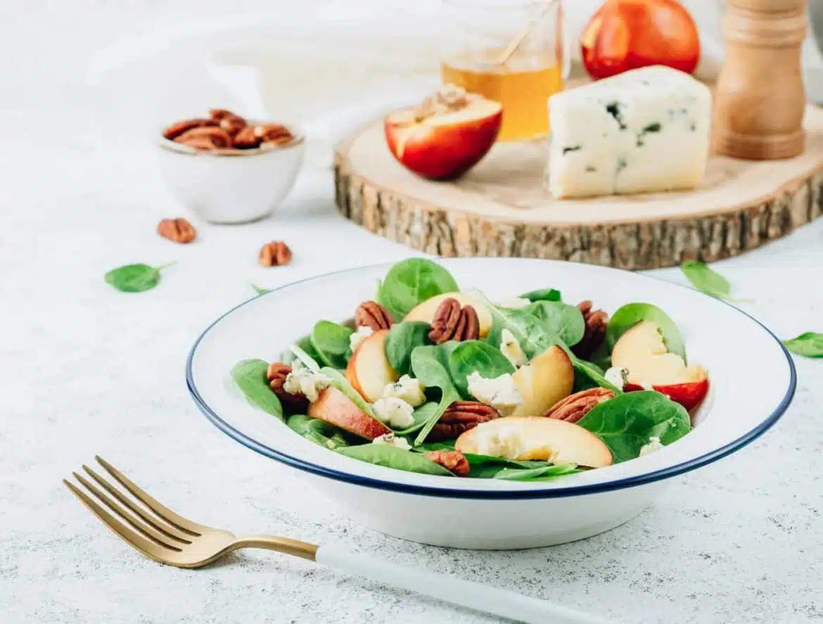 Salad with Spinach, Peach, Pecan Nuts and Blue Cheese
